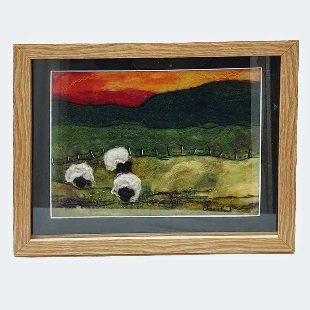 Felt painting of sheep at sunset - red sky at night