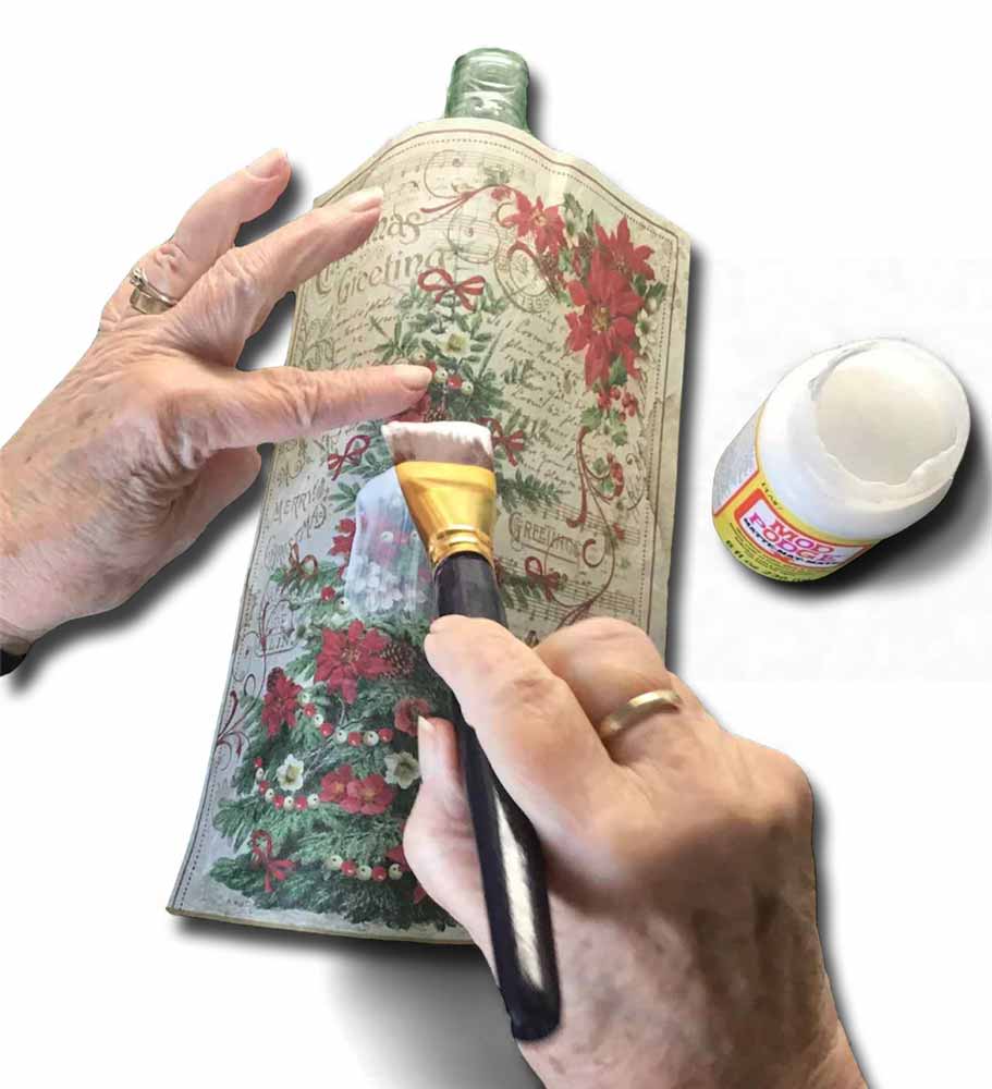 Making-a-decoupage-bottle-light match up design for snowman glass painted candle holder